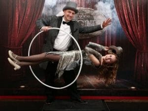 magician performing with woman floating e1605792465207
