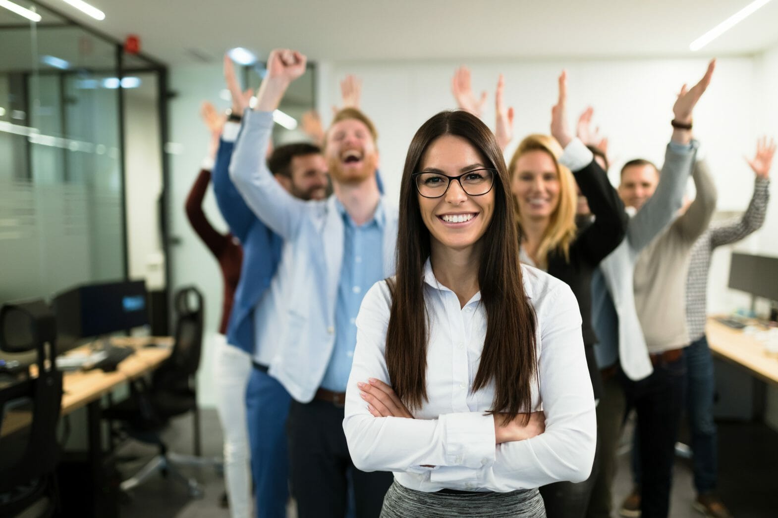 Portrait of successful business team posing in office